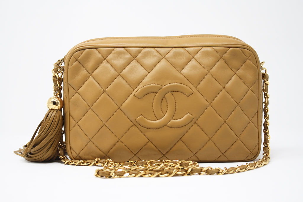 chanel bag with gold plate on top