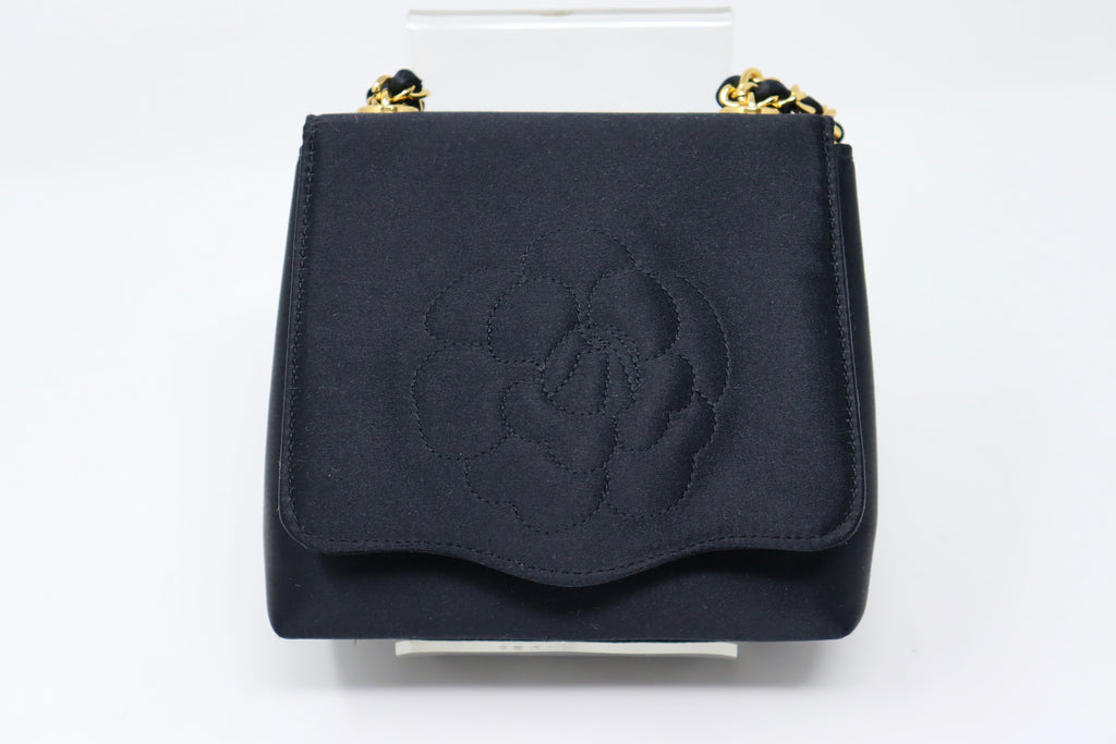 CHANEL Lambskin Camellia Embossed Yen Wallet Black 1171495