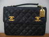 Vintage 80's CHANEL Quilted Black Leather Handbag with Gold & Leather Chain, CC Closure, & CHANEL Gold Name Tag, Converts to Top Handle Clutch