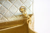 Vintage Chanel gold flap bag